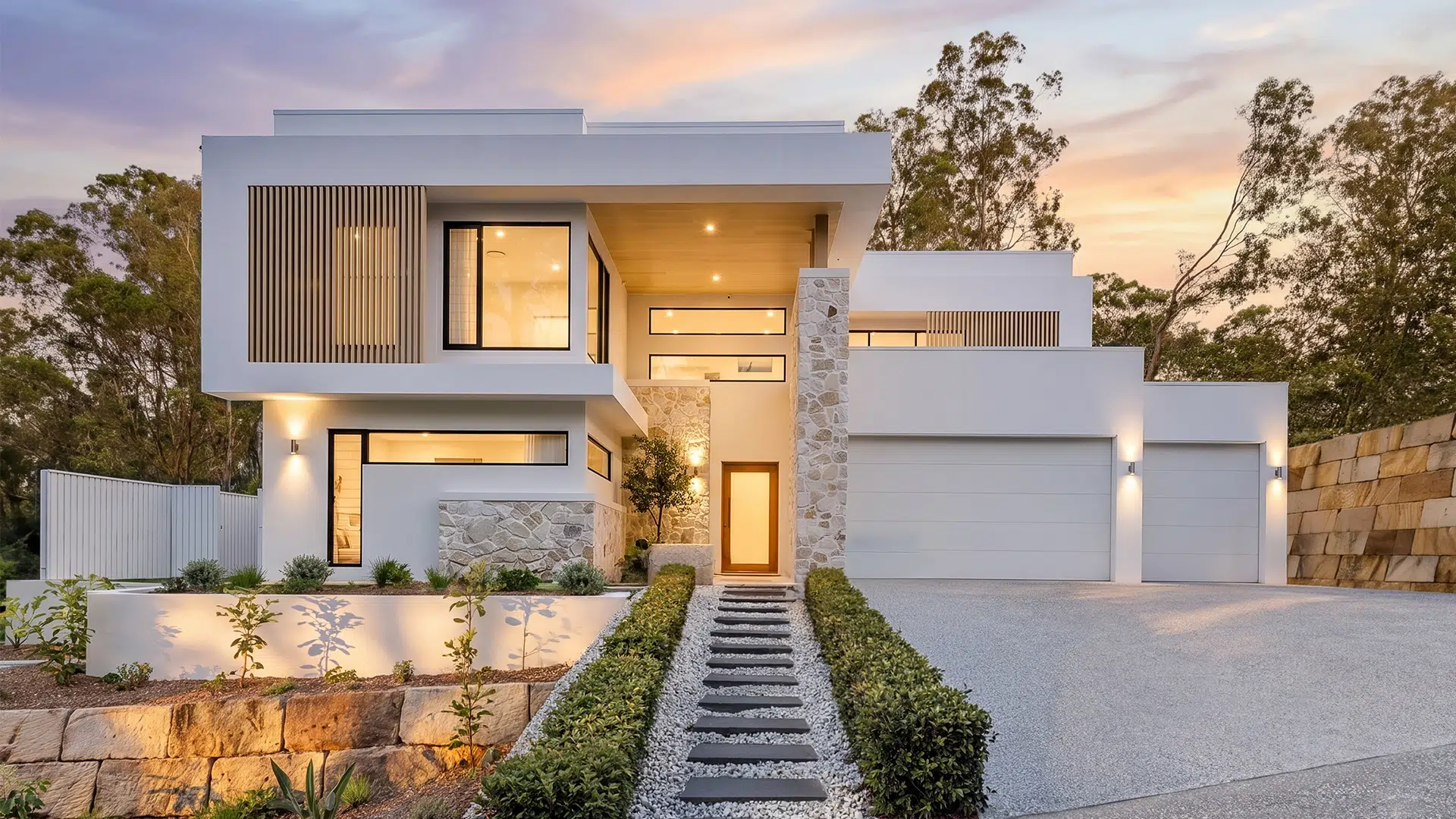 Luxury custom home builder Brisbane. Contemporary custom home in Fig Tree Pocket with a striking modern façade by BESA Design & Construct.