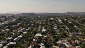 Drone arial shot of a Brisbane suburb with views of the CBD in the distance