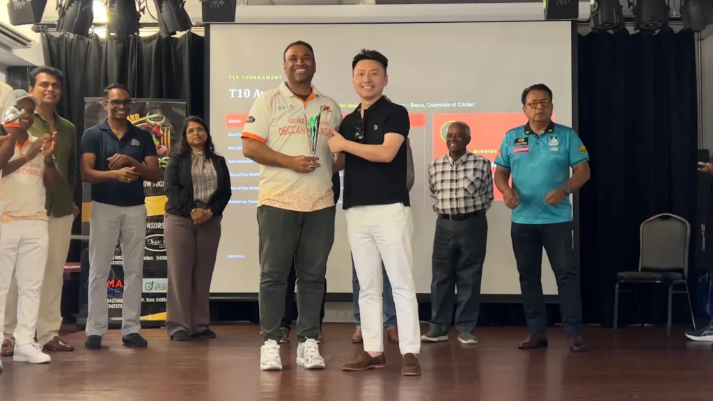 BESA's Managing Director presenting an award at the Queensland Deccan Chargers Cricket Club 2026 tournament
